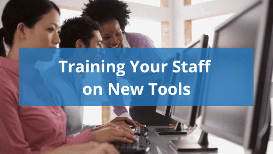 image of employees at desktop computers with someone supervising, text overlay reading "training your staff on new tools"